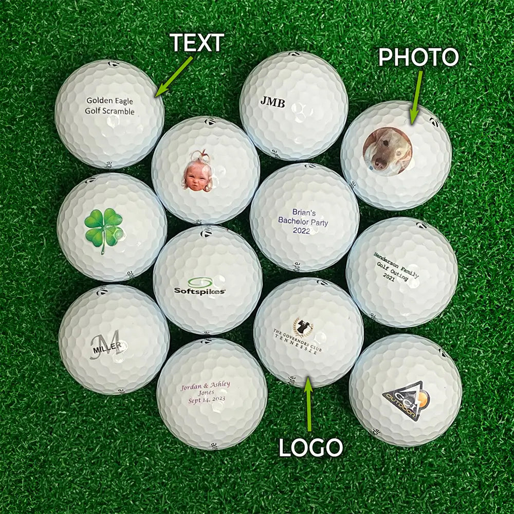 Collection of Taylormade golf balls with text, photo, and logo labels on a green surface