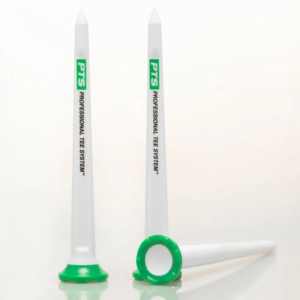 Three white golf tees with green bases and PTS Professional Tee System branding on a white background.