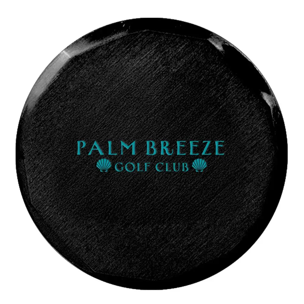 Black hammered metal golf ball marker with custom logo imprint.