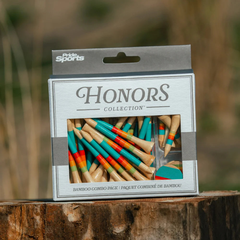 Honors Collection bamboo combo pack box with sunrise gradient tees sits outdoors on a tree stump.