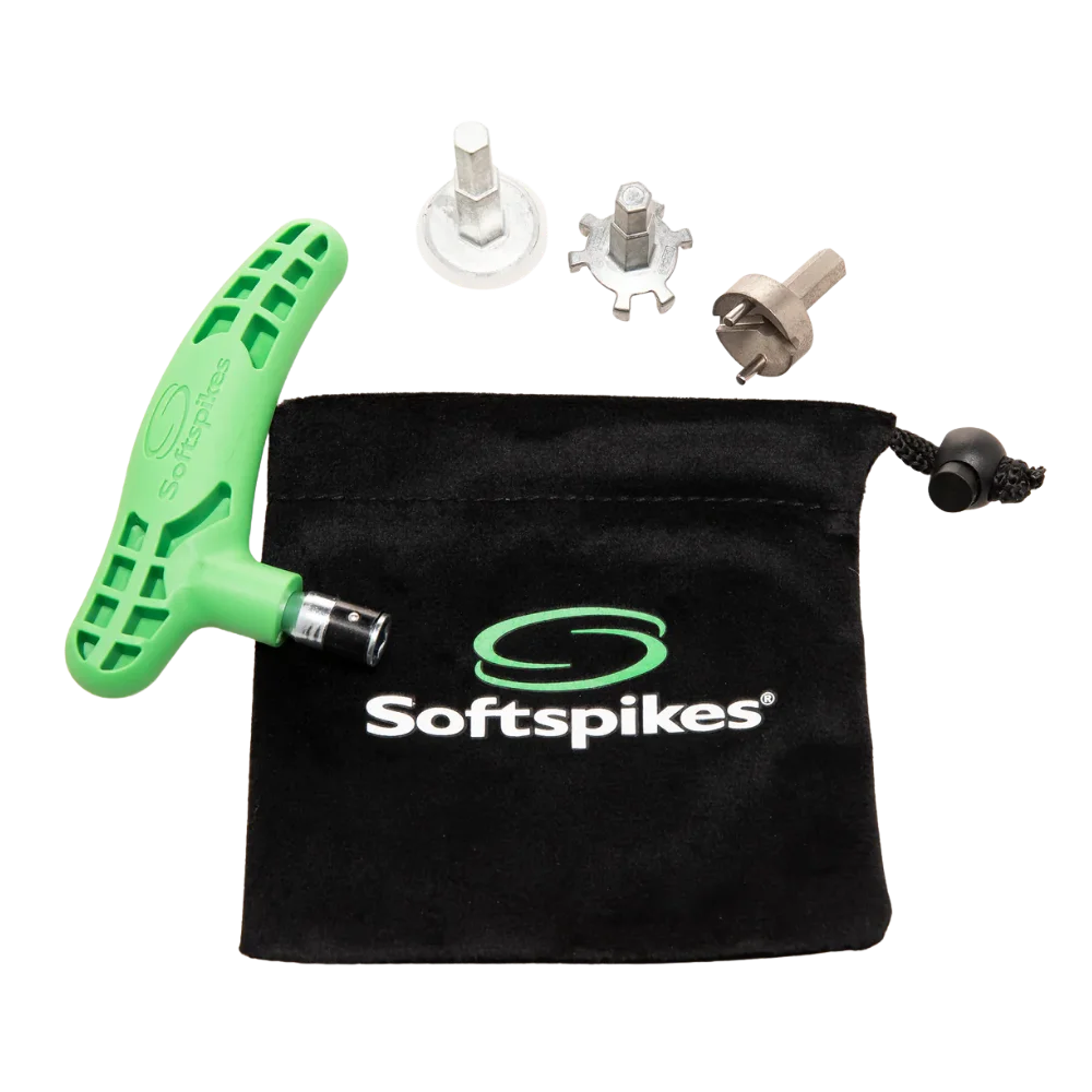 Green tool and metal spikes with a black Softspikes pouch on a white background