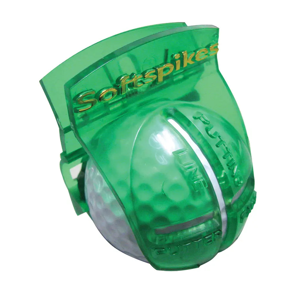 Green alignment tool, featuring the Softspikes brand, holding a golf ball on a white background