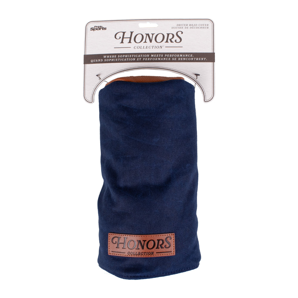 A navy blue waxed canvas Barrel Driver Headcover with a brown leather patch, hanging from Honors Collection retail packaging.