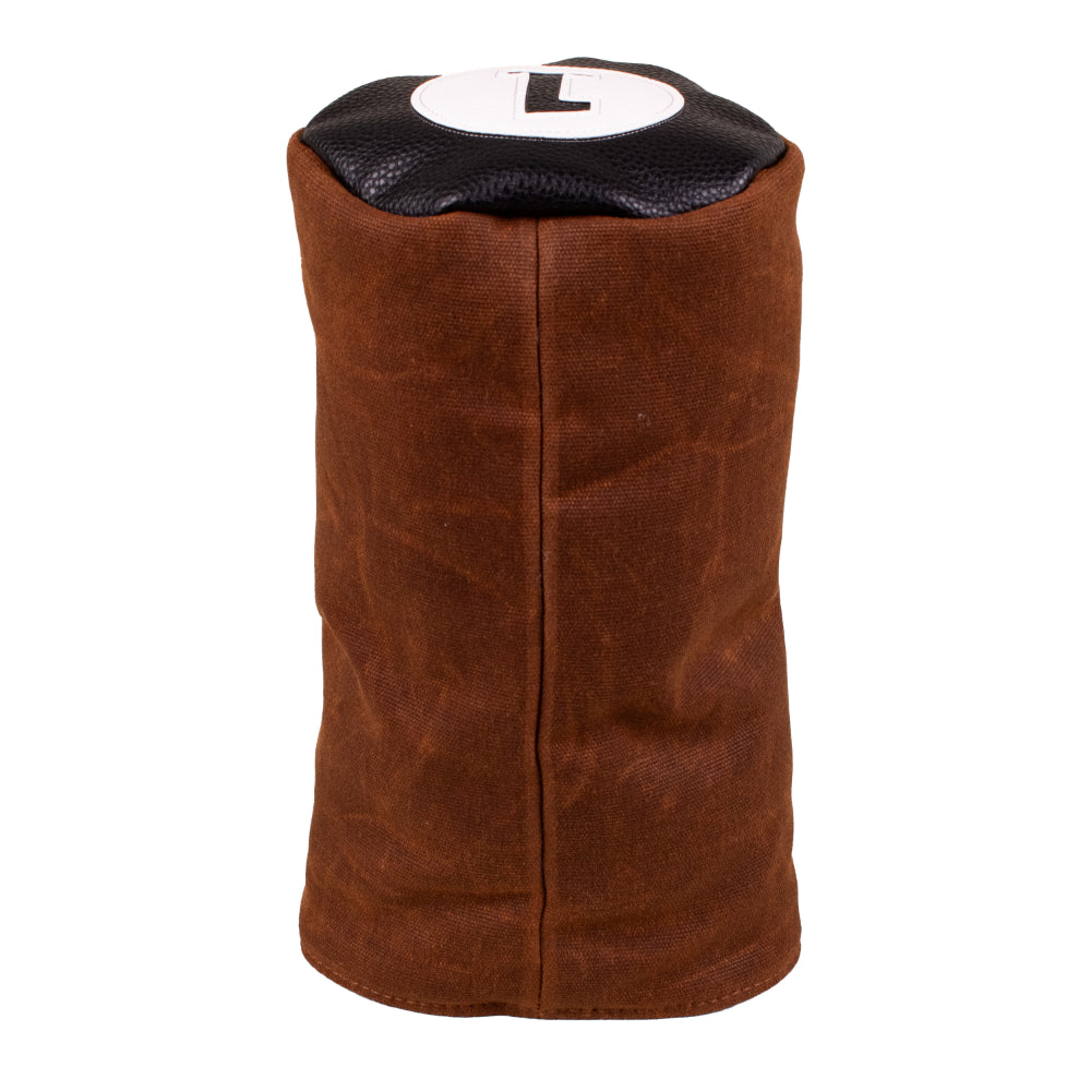 Barrel Driver Headcover made of brown waxed canvas with a black leather top featuring a white patch with the letter 1.