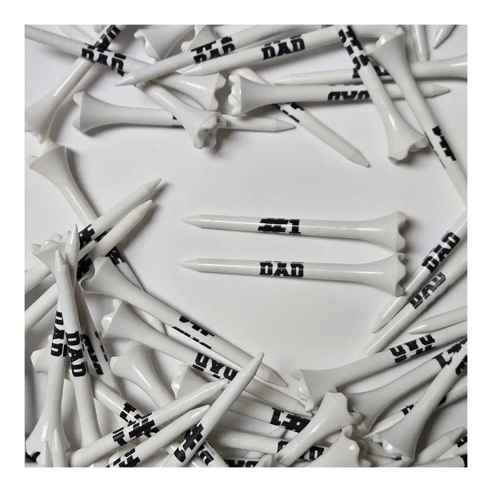 White golf tees with '# 1 DAD' printed on them arranged in a circular pattern.