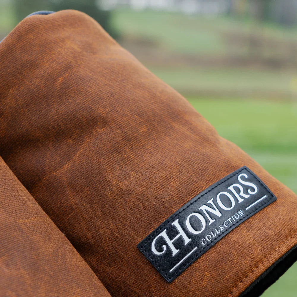 Barrel Driver Headcover made of brown waxed canvas with a black label that reads HONORS COLLECTION.